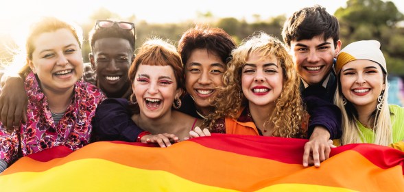 Diverse young friends celebrating gay pride festival - LGBTQ community concept