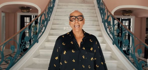 RuPaul opens the front door to his huge Beverly Hills mansion.