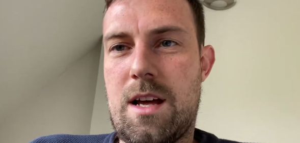 Joshua Sutcliffe, in a white room, speaking to a camera.