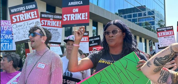 Trans and non-binary TV and film writers on the picket line outside Netflix in LA, as part of the ongoing writers' strike.