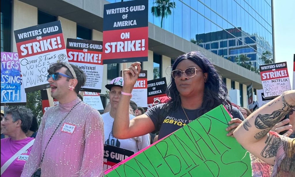 Trans and non-binary TV and film writers on the picket line outside Netflix in LA, as part of the ongoing writers' strike.