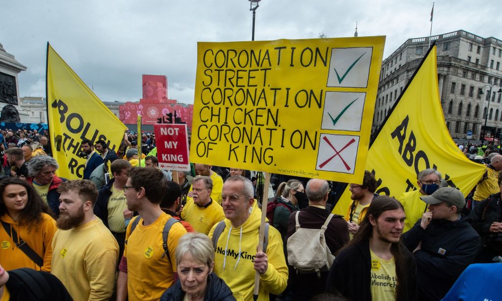 A person holds up a sign in protest of the monarchy on the morning of King Charles III's coronation in the UK