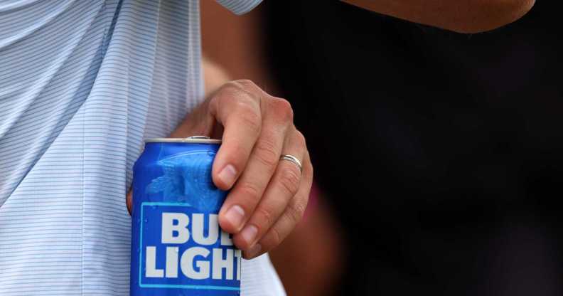 Man holds a Bud Light can