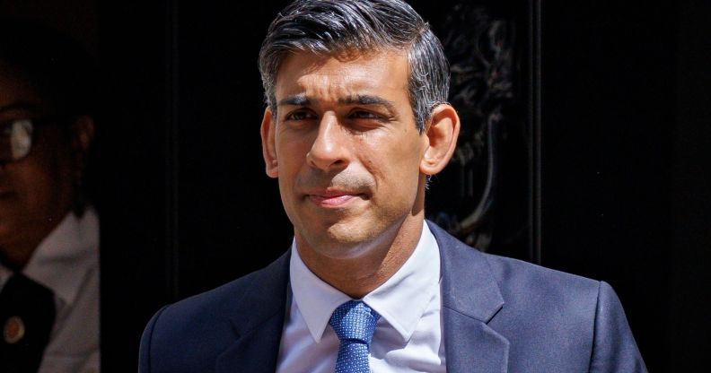 Rishi Sunak walking out the door of Number 10.