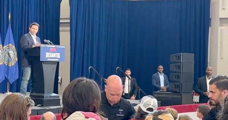 A woman interrupts Ron DeSantis' New Hampshire campaign speech