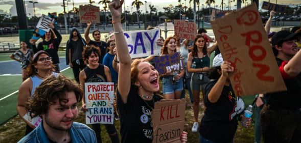 LGBTQ rights supporters protest against Florida Governor Ron Desantis outside a "Don't Tread on Florida" tour campaign event.