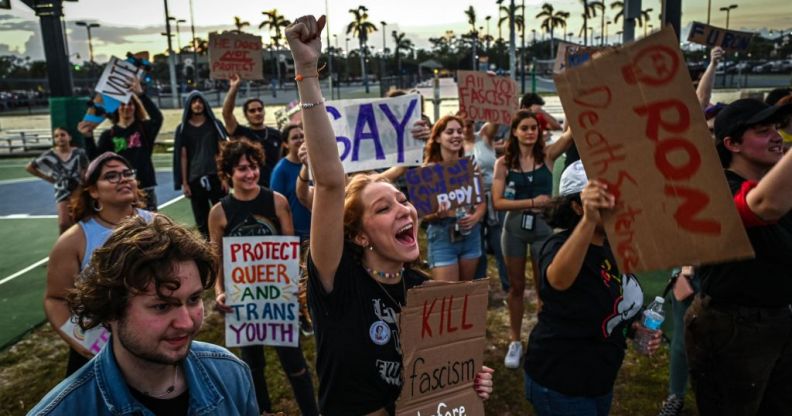 LGBTQ rights supporters protest against Florida Governor Ron Desantis outside a "Don't Tread on Florida" tour campaign event.