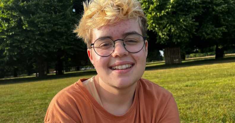 Beckett Seaton-Bailey, a young white transmasc person with bleach blonde hair