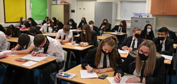 A group of students in a UK school gather together to take their GCSEs