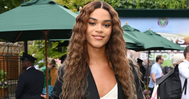 Yasmin Finney wears a white top and black blazer at Wimbledon.