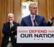 (L-R) Steve Scalise, Tom Emmer, Kevin McCarthy and Elise Stefanik stand around a press room discussing the recently passed National Defense bill, with McCarthy at a podium that says "defend our nation."