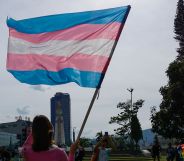 Activist holds trans flag on International Day Against Homophobia, Biphobia and Transphobia on May 20, 2023 in San Salvador, El Salvador