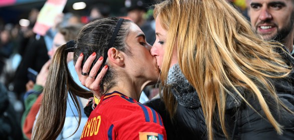 Alba Redondo of Spain kisses her partner Cristina Monleón as she celebrates her team's 5-0 victory with her family after the FIFA Women's World Cup Australia and New Zealand 2023 Group C match between Spain and Zambia at Eden Park on July 26, 2023 in Auckland / Tāmaki Makaurau, New Zealand. (Photo by Hannah Peters - FIFA/FIFA via Getty Images)