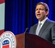 Florida governor Ron DeSantis stands at a podium