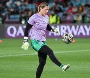 England goalkeeper Mary Earps kicks a football in an action shot