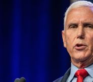 Republican presidential candidate Mike Pence, who has promised to bring back the trans military ban, wears a light blue shirt, red tie and dark jacket as he speaks at an event