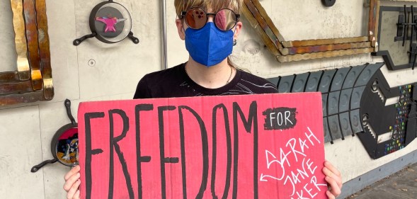 A protesters hold a Freedom for Sarah Jane Baker sign at a London protest