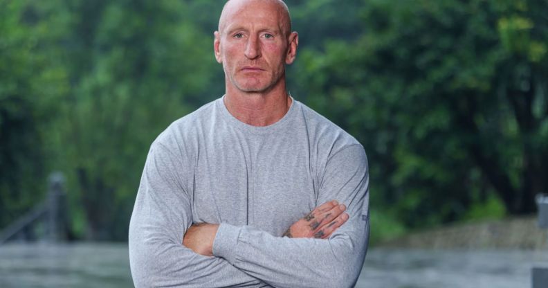 Gareth Thomas wears a grey sweatshirt and folds his arms in the promo photo for Celebrity SAS Who Dares Wins.