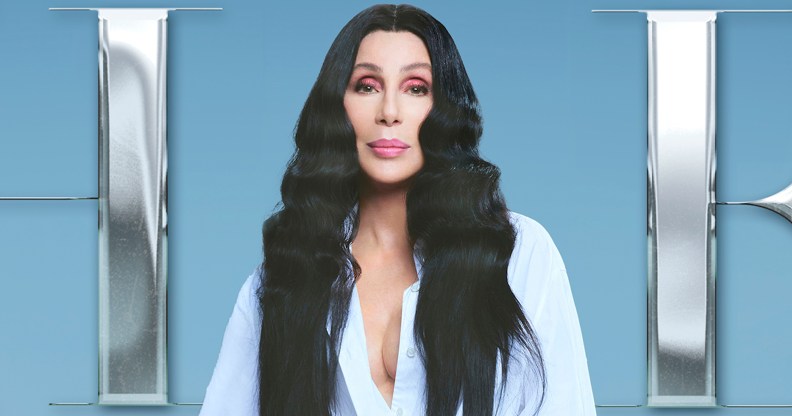 Cher with long black hair and a white shirt on the cover her her album 'Christmas'