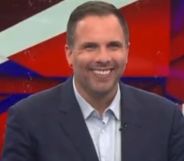 Dan Wootton in the GB News studio smiling.