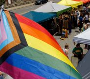 An LGBTQ+ flag waving above a market in Ohio.