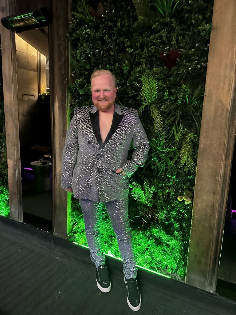 Jamie Dods after treatment. He is pictured here wearing a silver suit.
LGBTQ+ survivors share their experiences of navigating the world of online dating after cancer or another serious illness.