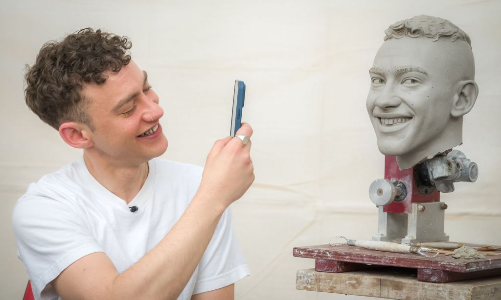 Olly Alexander photographs the head of his Madame Tussauds wax figure.