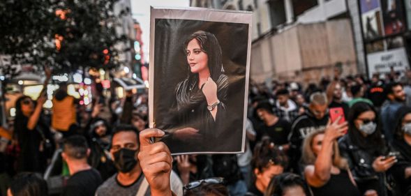 People gather together in protest one year after the death of Mahsa Amini, a Kurdish-Iranian woman who died in the custody of Iran's 'morality police'. Women and LGBTQ+ people have led the protests calling for their human rights in Iran