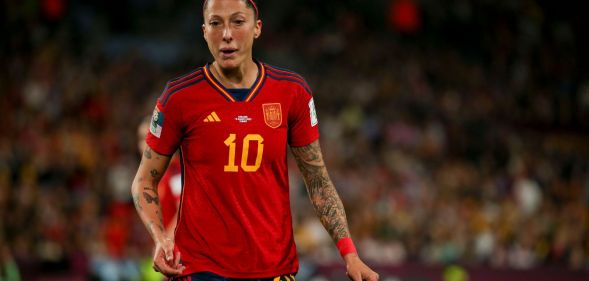 Spain's World Cup-winning midfielder Jenni Hermoso wears a red and yellow football uniform as she plays during a match