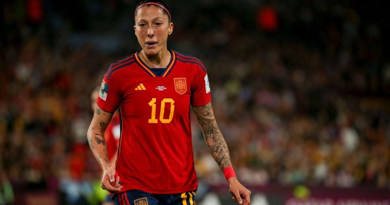 Spain's World Cup-winning midfielder Jenni Hermoso wears a red and yellow football uniform as she plays during a match