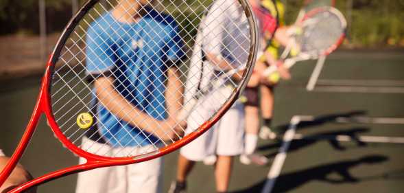 Students playing tennis.