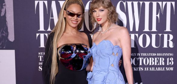 Beyoncé and Taylor Swift stand next to one another at the Taylor Swift: The Eras Tour film premiere.