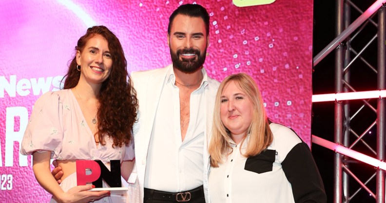 Rylan presents Contiki with the Travel and Hospitality Award at the PinkNews Awards 2023. (PinkNews)