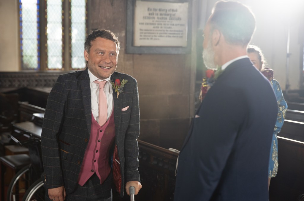 Peter Ash (left) as Paul and and Daniel Brocklebank as Billy in church at their wedding on Coronation Street