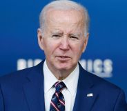 A shoulder-height picture of Joe Biden on stage of a Bidenomics conference.