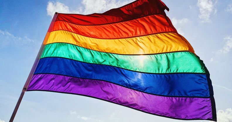 Stock image of a rainbow flag waving