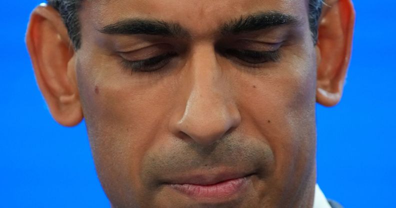 A close up of Rishi Sunak looking down.