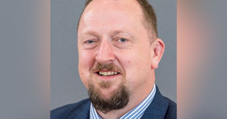 A picture of DUP councillor Colin Kennedy wearing a white and blue striped shirt, blue suit jacket and tie