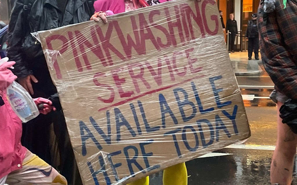 Fossil Free Pride sign at PinkNews protest