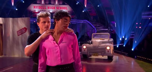 Layton Williams performs in a pink and black drag look for a Grease-inspired dance on Strictly Come Dancing