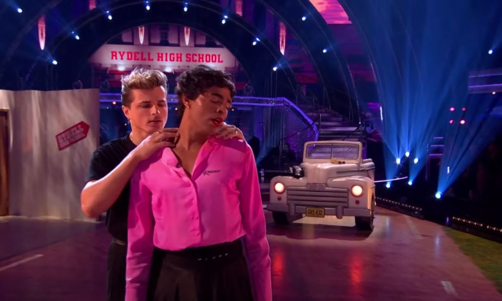 Layton Williams performs in a pink and black drag look for a Grease-inspired dance on Strictly Come Dancing