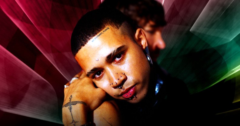 Queer poet, model and author Kaiden Ford embracing another figure