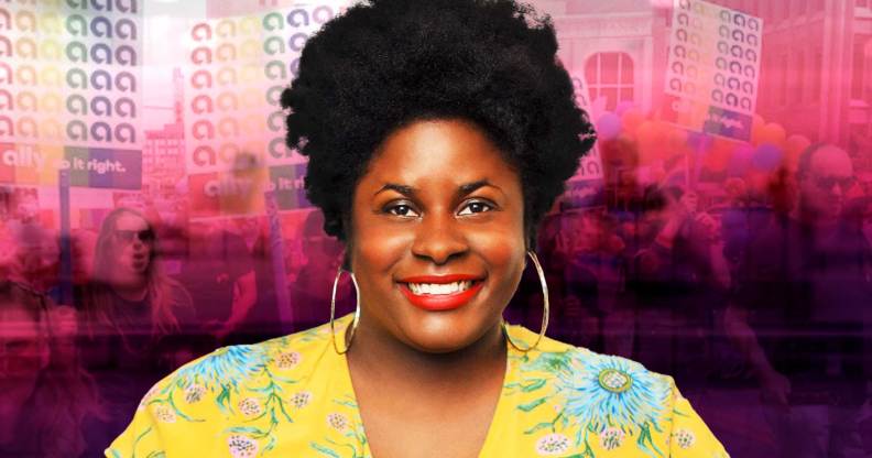 A Black woman is smiling center in the image. She is wearing a bright yellow top. Behind her is a creatively overlay of a Pride Parade in pink and black hues.