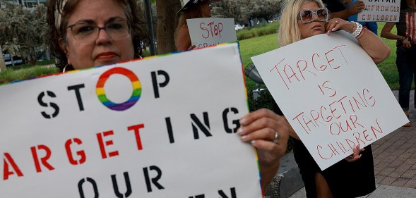 MIAMI, FLORIDA - JUNE 01: (L-R) Marlene (did not want to provide last name) and Jill Dahne protest outside of a Target store on June 01, 2023 in Miami, Florida. The protesters were reacting to Pride Month merchandise featuring the rainbow flag in support of the rights of the lesbian, gay, bisexual, transgender, and queer communities that had been sold at Target stores. Target removed certain items from its stores and made other changes to its LGBTQ+ merchandise after a backlash from some customers. (Photo by Joe Raedle/Getty Images)