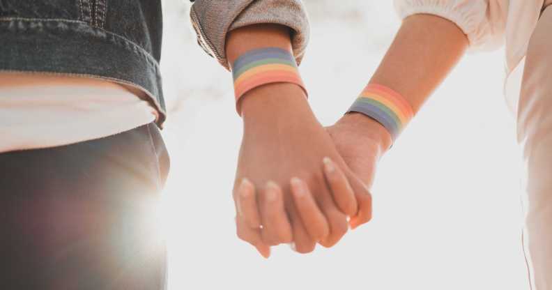 LGBTQ+ couple holding hands