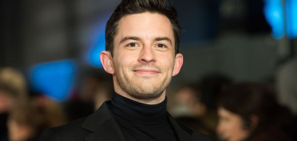 Jonathan Bailey in a black blazer and roll neck.