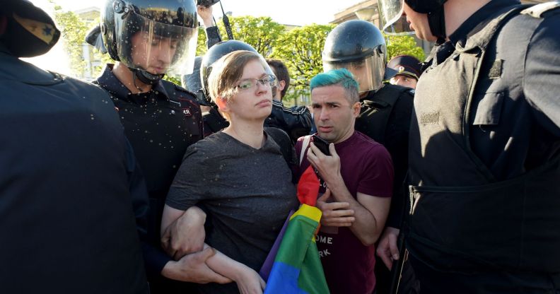 Russian riot police detain LGBTQ+ rights activists during a St Petersburg march in May 2019.